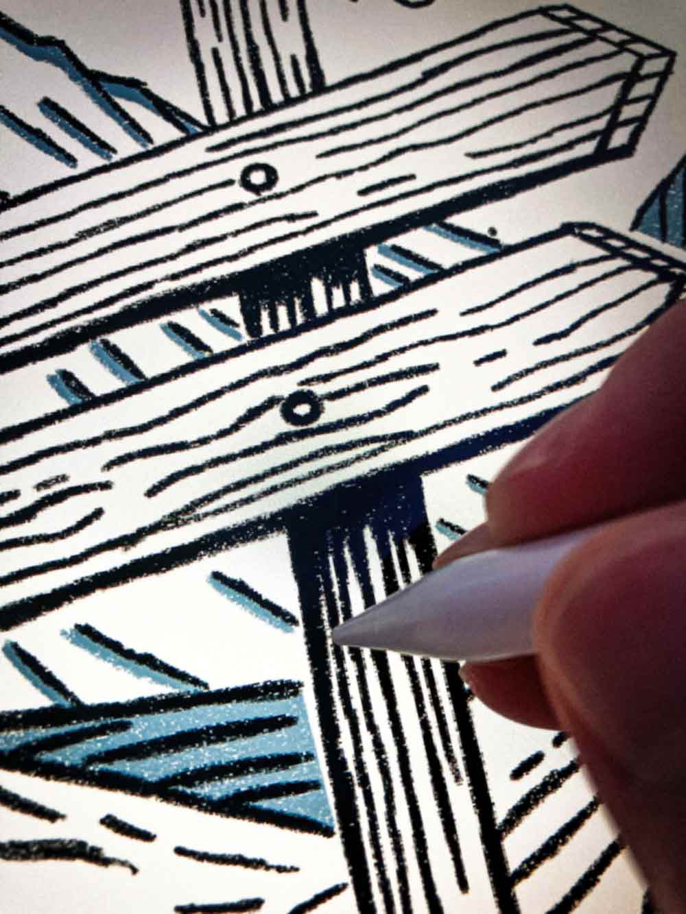 Hand holding a pen over a detailed black and white illustration of a wooden trail signpost.