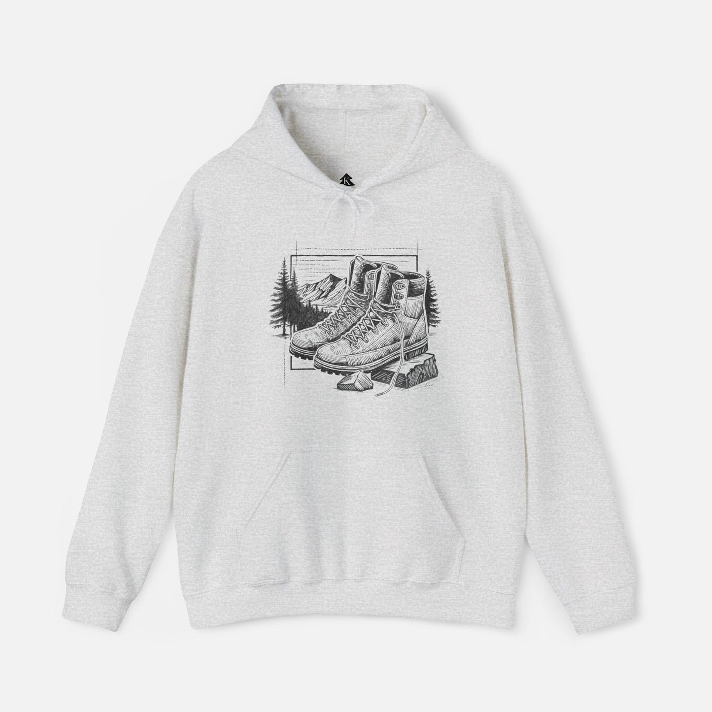 Trek & Trail Hoodie in Ash color displayed on a white background, showcasing the detailed hiking boot and trail illustration.