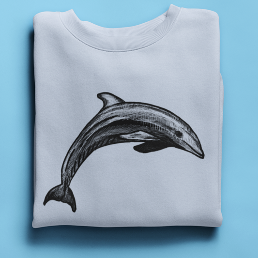 Close-up of minimalist dolphin illustration on sweatshirt fabric, showcasing the fine pen-and-ink detailing and ocean-inspired artwork.