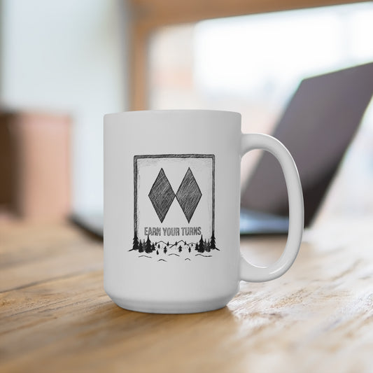 A 15oz ceramic mug featuring a cool Ski Graphic Sign design with the message Earn Your Turns and a Black Diamond Mountain illustration on a white background. Perfect of ski lodge.