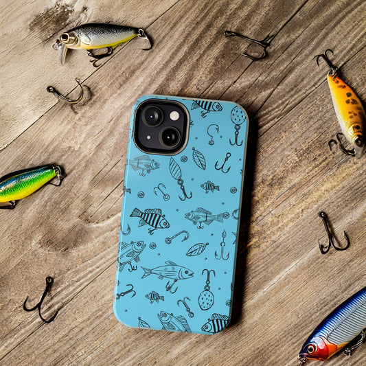 Fish Lure Phone Case with a detailed fishing lure pattern, shown on a rustic wood desk with hooks and fishing lures for an outdoor-inspired setting.