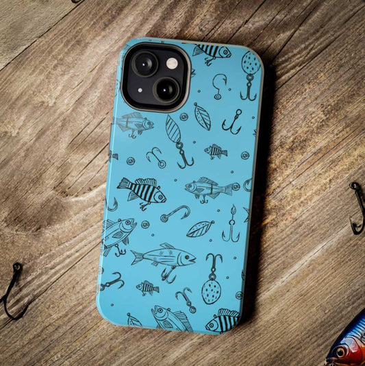 Fish Lure Phone Case with a detailed fishing lure pattern, shown on a rustic wood desk with hooks and fishing lures for an outdoor-inspired setting.
