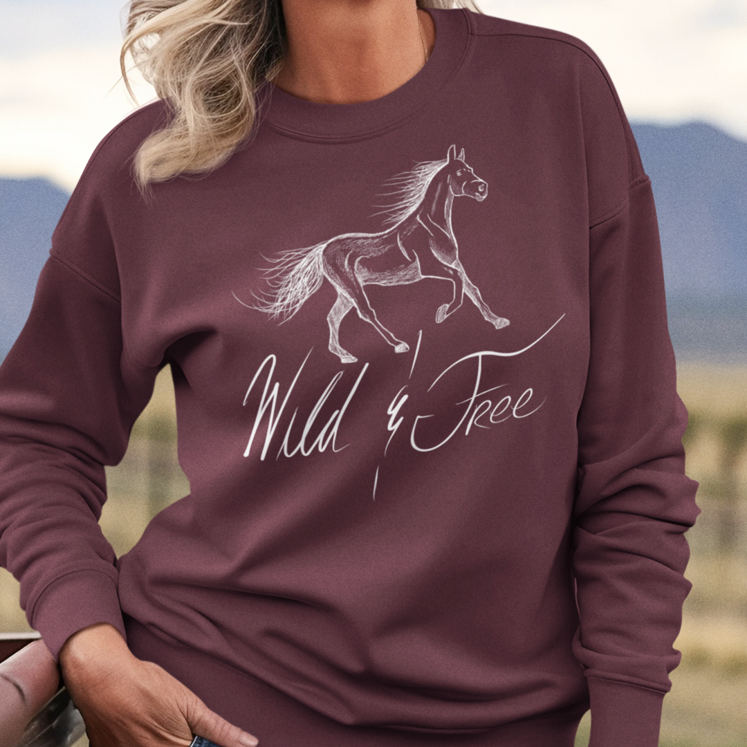 Model wearing Wild and Free Elegant Horse Illustration Sweatshirt, showcasing the stylish equestrian-themed design and cozy crewneck fit for horse lovers.