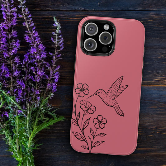 Hummingbird & Flowers Phone Case styled on wooden table with flowers, showcasing artistic and nature-inspired design.