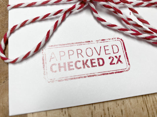 close up of envelope stamp "approved and checked 2X" by Santa