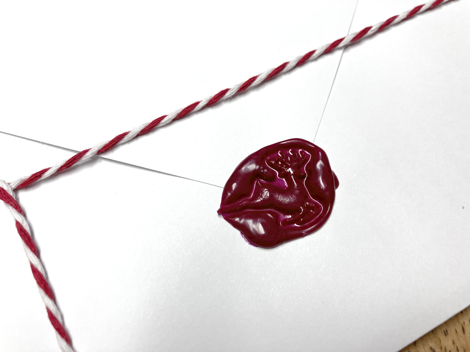 close up of wax seal with reindeer.