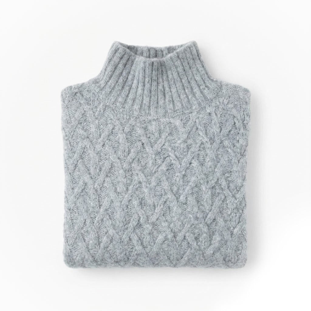 Light Grey alpaca wool sweater featuring a lattice cable knit pattern and mock neck design on a white background.