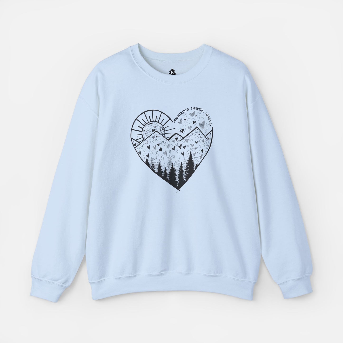 A light blue crewneck sweatshirt featuring a heart-shaped mountain design with the text and Mountains Inspire Hearts, perfect for anyone that loves hiking, mountain views, or the outdoors.