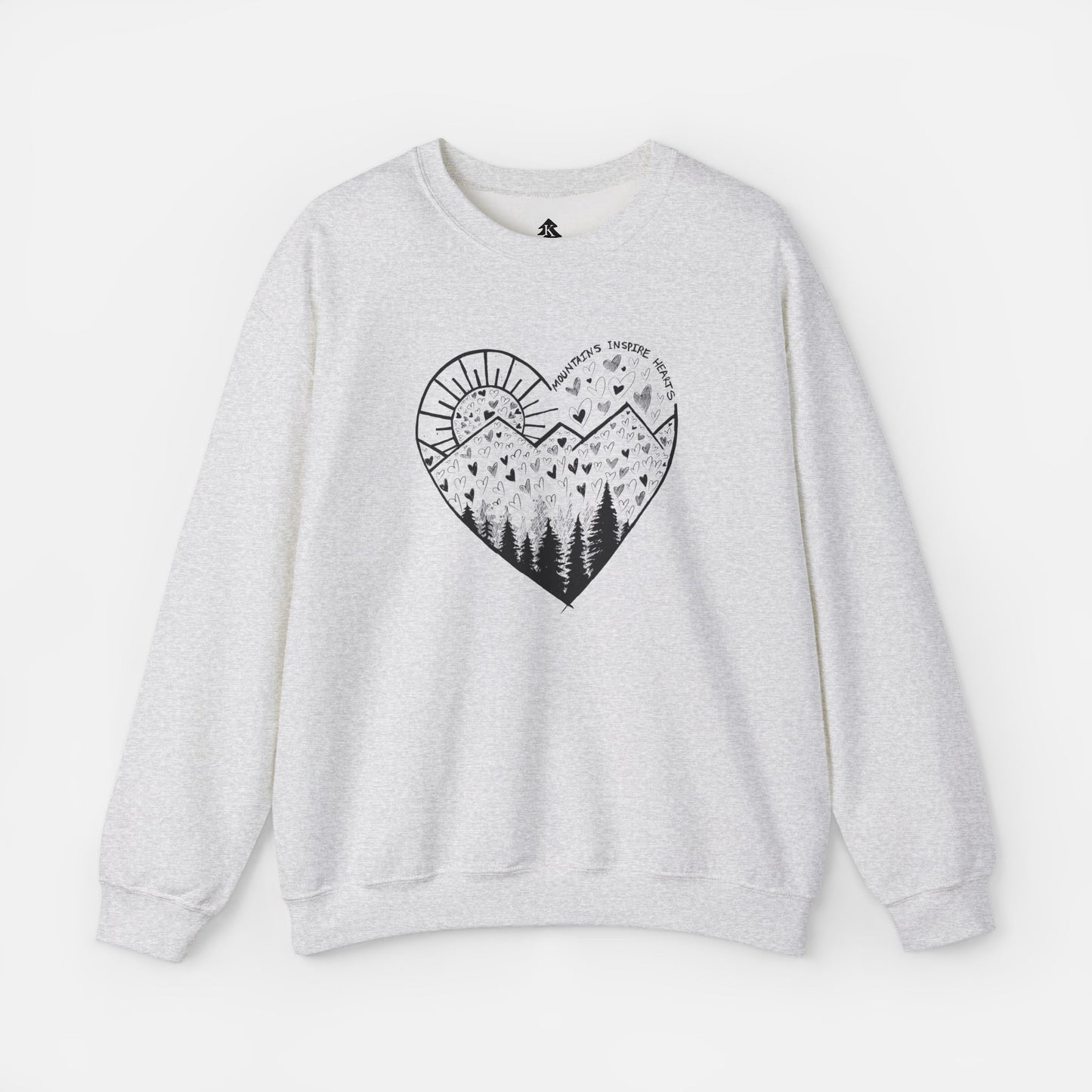 A light gray crewneck sweatshirt featuring a heart-shaped mountain design with the text and Mountains Inspire Hearts, perfect for anyone that loves hiking, mountain views, or the outdoors.