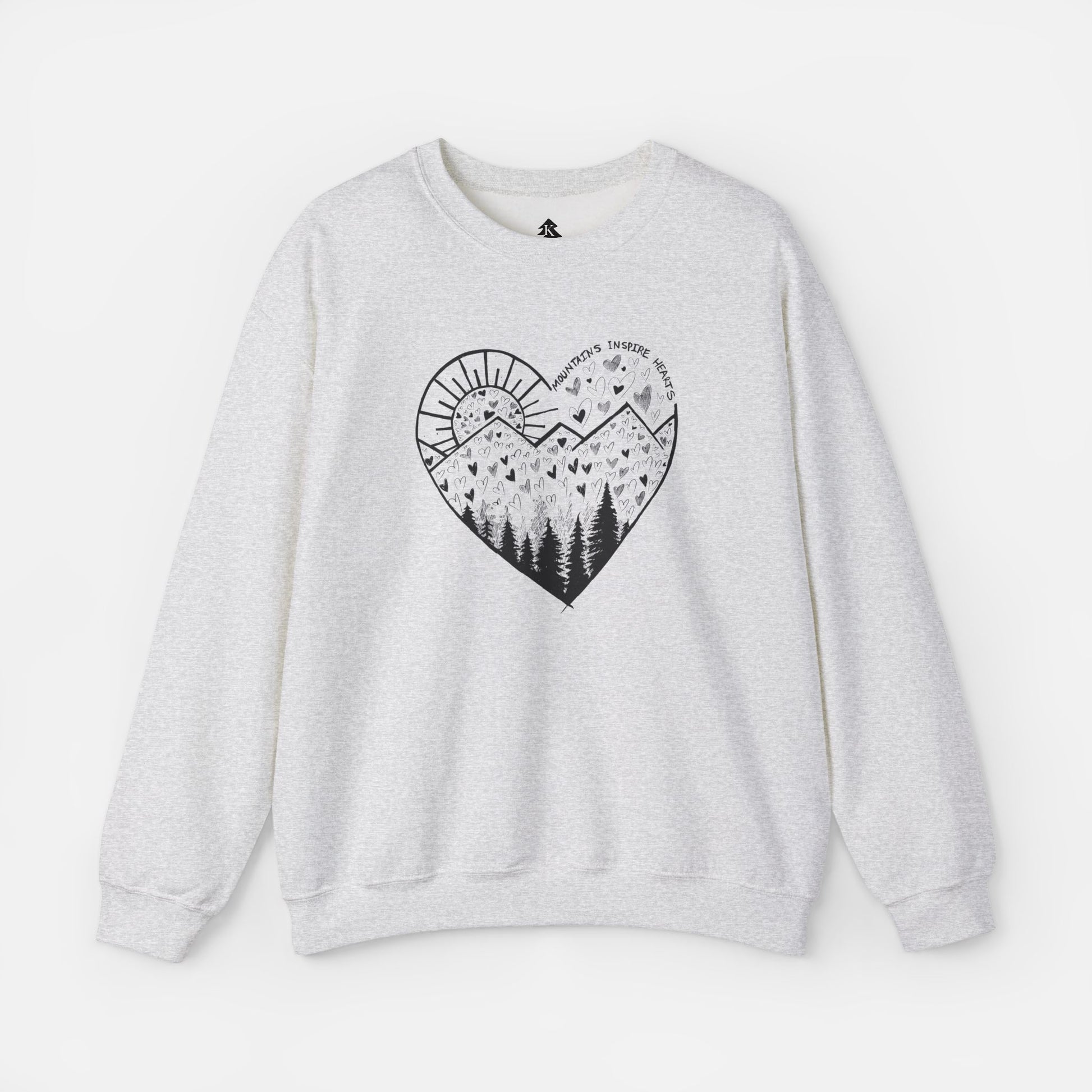 A light gray crewneck sweatshirt featuring a heart-shaped mountain design with the text and Mountains Inspire Hearts, perfect for anyone that loves hiking, mountain views, or the outdoors.