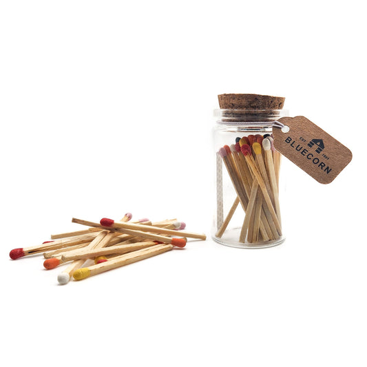 Jar of matches with a cork lid and 'Bluecorn' tag on a white background