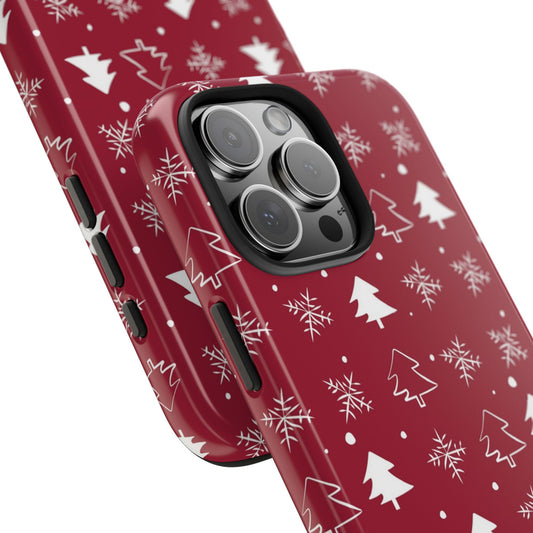 Close-up view of the camera area on a red phone case with a winter pattern featuring snowflakes and Christmas trees, showcasing the precise cutout and festive design details, compatible with iPhone and Samsung models.