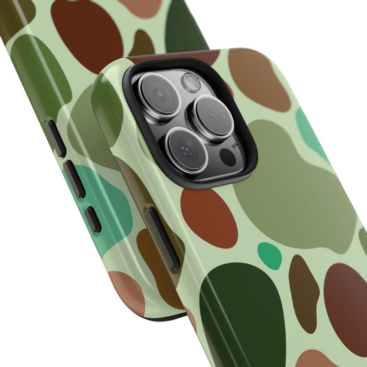 Close-up view of a phone case with a turtle shell camo pattern, highlighting the intricate design details, compatible with iPhone and Samsung models.