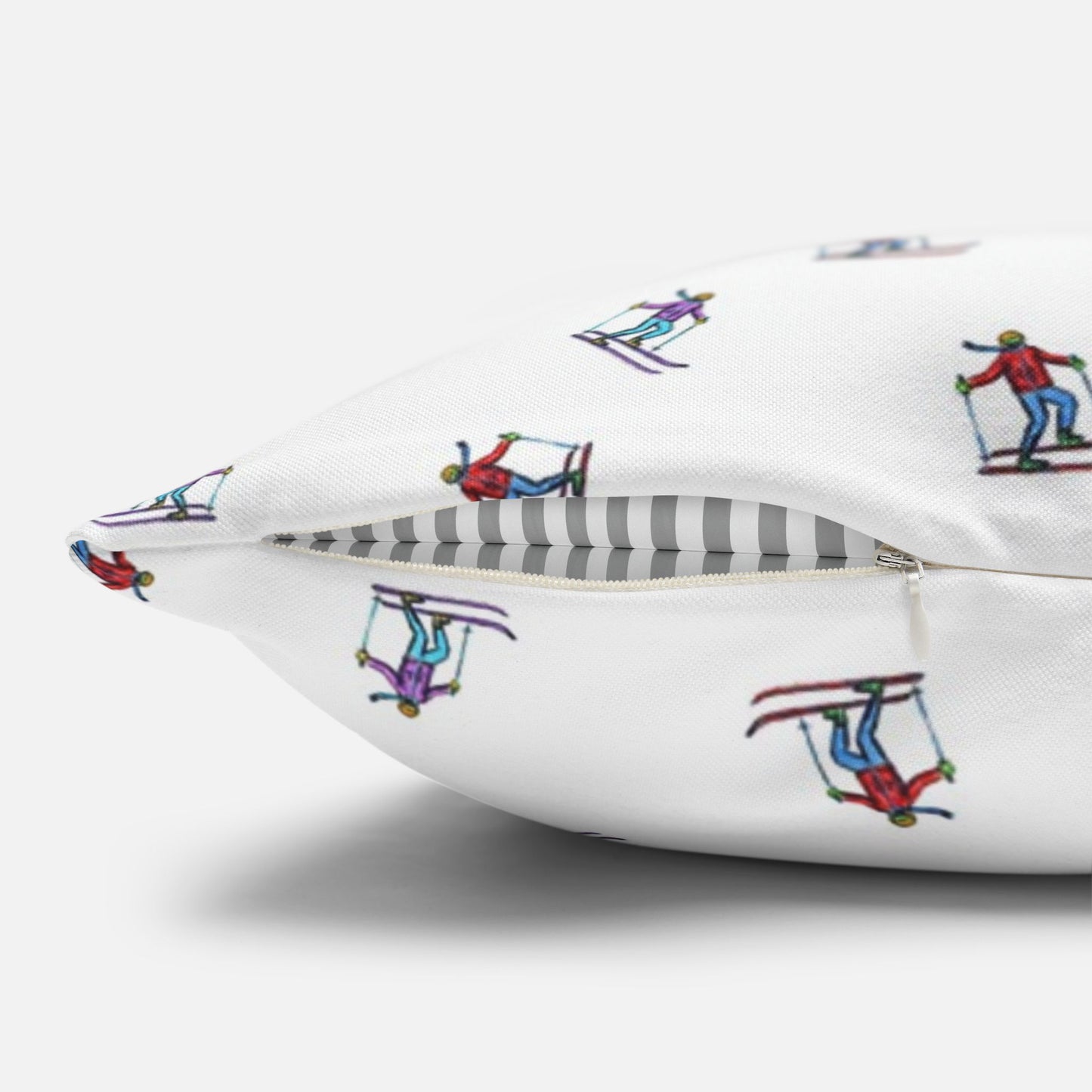 Close-up view of the zipper area on a pillow case featuring an illustrated skier pattern, showcasing the quality and detailed design of the 'Carving the Slopes' winter sports theme.