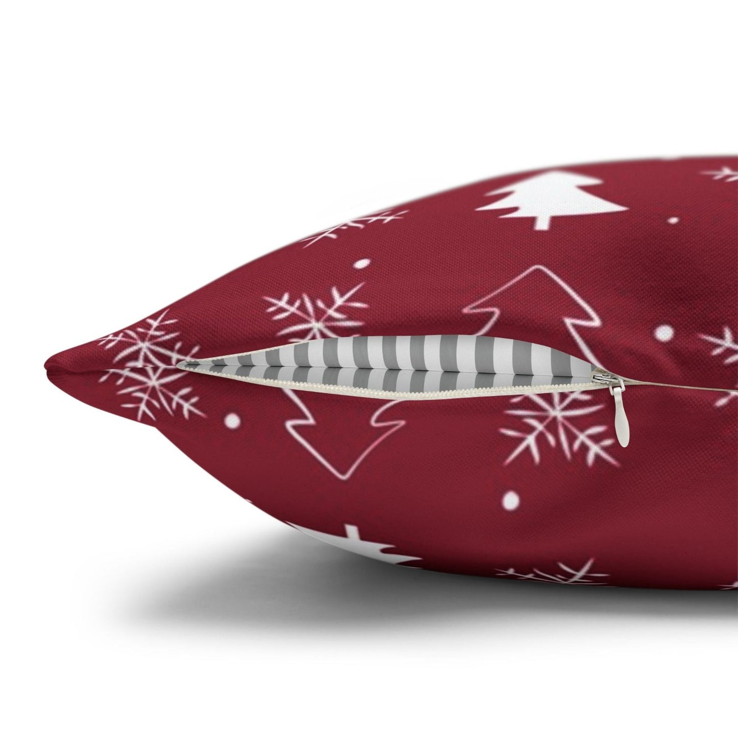 Close-up view of the zipper area on a red pillow case with a winter snowflake and tree pattern, showcasing the detailed design and quality of the closure.