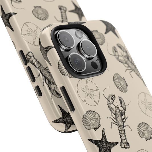 Angled close-up of Coastal Shells Phone Case highlighting the elegant marine-themed artwork and sleek glossy finish.