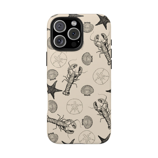Front view of Coastal Shells Phone Case on white background, featuring hand-illustrated lobster, scallop, starfish, and sand dollar for a refined beach-inspired design.