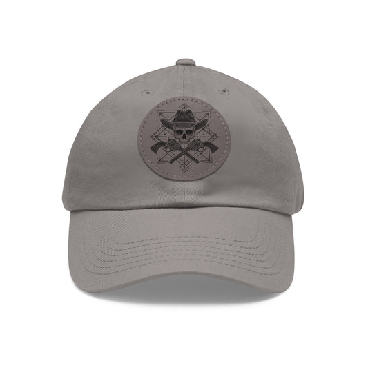 Front of cowboy skull cap by Kempain Family Outfitters showing design of the patch with skull wearing a cowboy hat and pistols crossed in a geometric illustration.