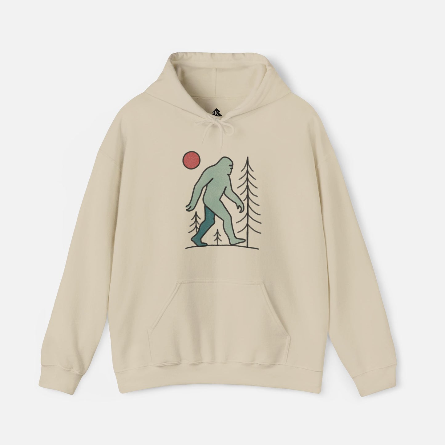 Bigfoot Beige hoodie with a graphic of a Sasquatch, trees, and a red circle moon on a white background