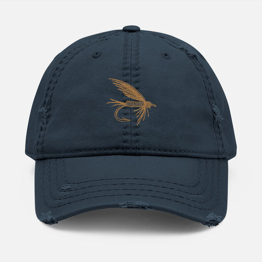 Front view of navy option featuring the Distressed Fishing Fly Dad Hat on a white background, showing the embroidered fishing fly design and pre-worn, rugged cotton twill finish.