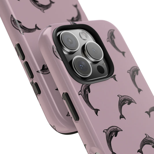 Close up photo of a dolphin pattern phone case with a purple color base on a white background. Perfect for anyone who loves the ocean.