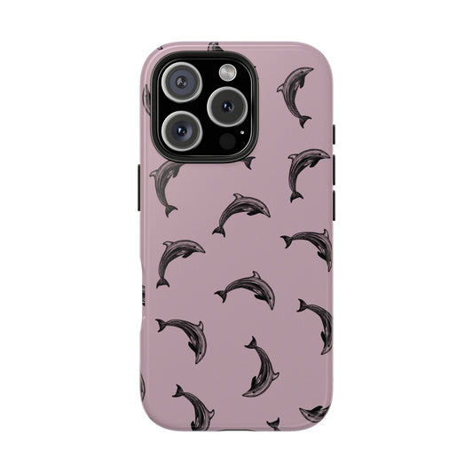 A dolphin pattern phone case with a purple color base on a white background. Perfect for anyone who loves the ocean.