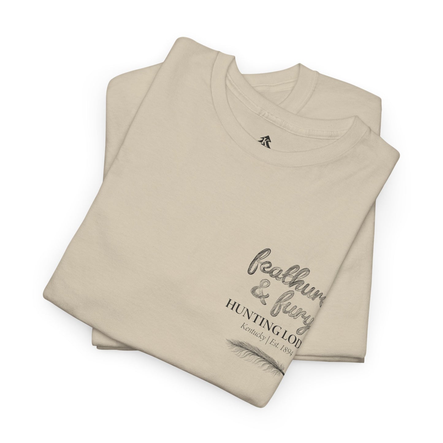 Sand color folded Feathers & Fury Hunting Lodge Tee on a white background, highlighting its comfortable fabric and detailed turkey hunting graphic.