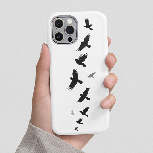 Flying Crows Silhouette Phone Case shown hand-held against a gray background, highlighting its bold black bird design and sleek, minimalist aesthetic.