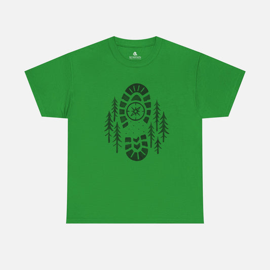 Irish Green Boot Print Compass Forest T-Shirt worn by model in a pine forest setting, showcasing rugged hiking design for nature lovers.