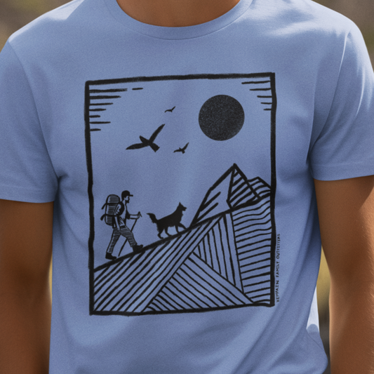 Model wearing Hiker & Dog Companion Tee, featuring a geometric mountain hiker and dog design, perfect for hikers, dog lovers, and outdoor adventurers.