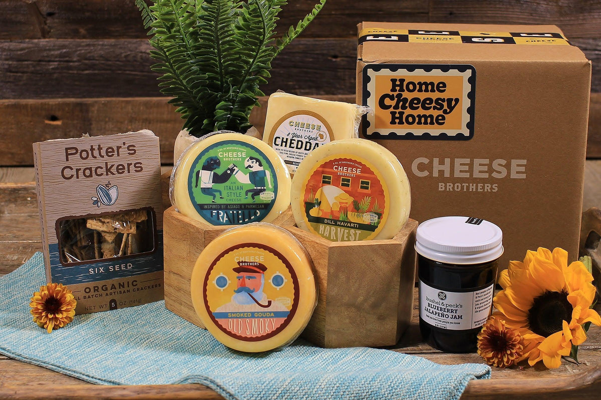 A Housewarming Gift Pack featuring Cheese Brothers 8-Year Aged Cheddar and Artisan Dill Havarti curated by Kempain Family Outfitters.