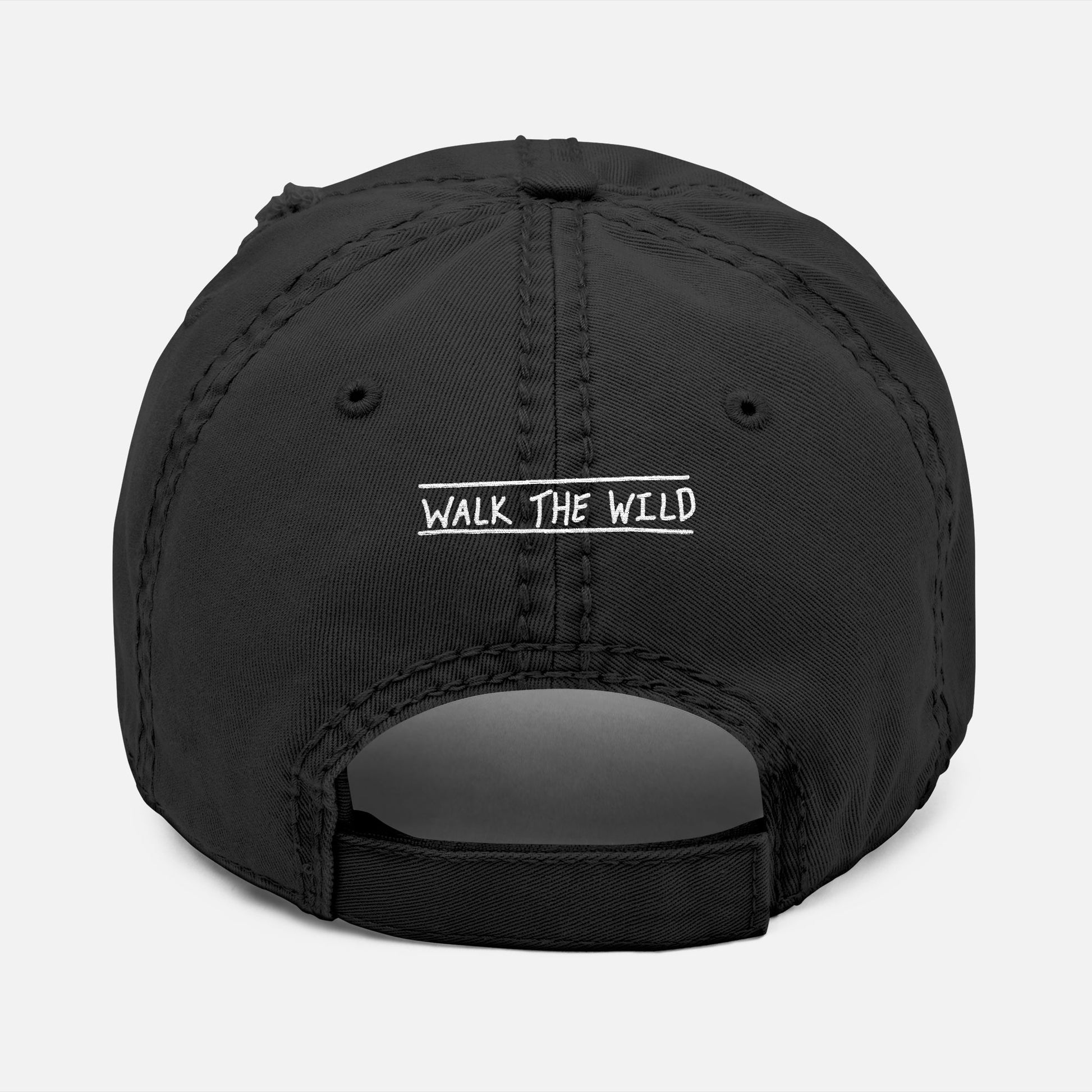 Back view of black dad hat with adjustable strap and “Walk the Wild” embroidered in a hand-drawn font, celebrating the bond of the hunt.
