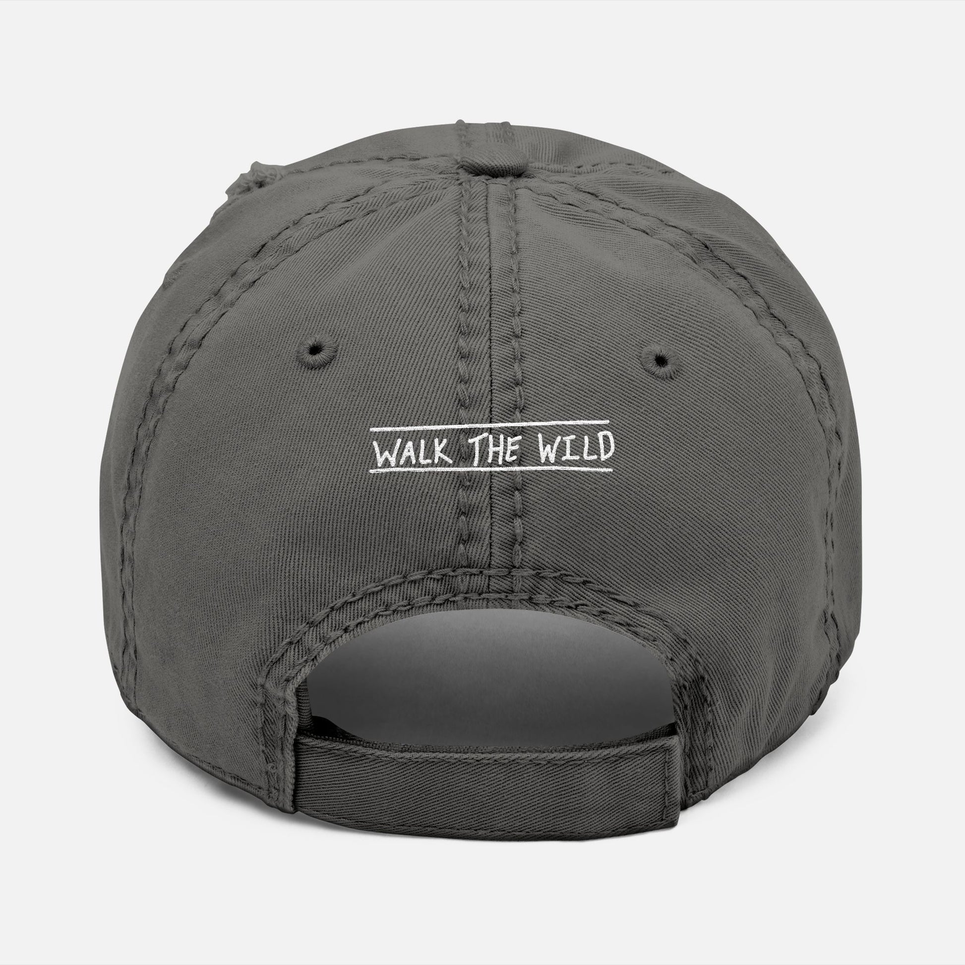 Back view of grey dad hat with adjustable strap and “Walk the Wild” embroidered in a hand-drawn font, celebrating the bond of the hunt.