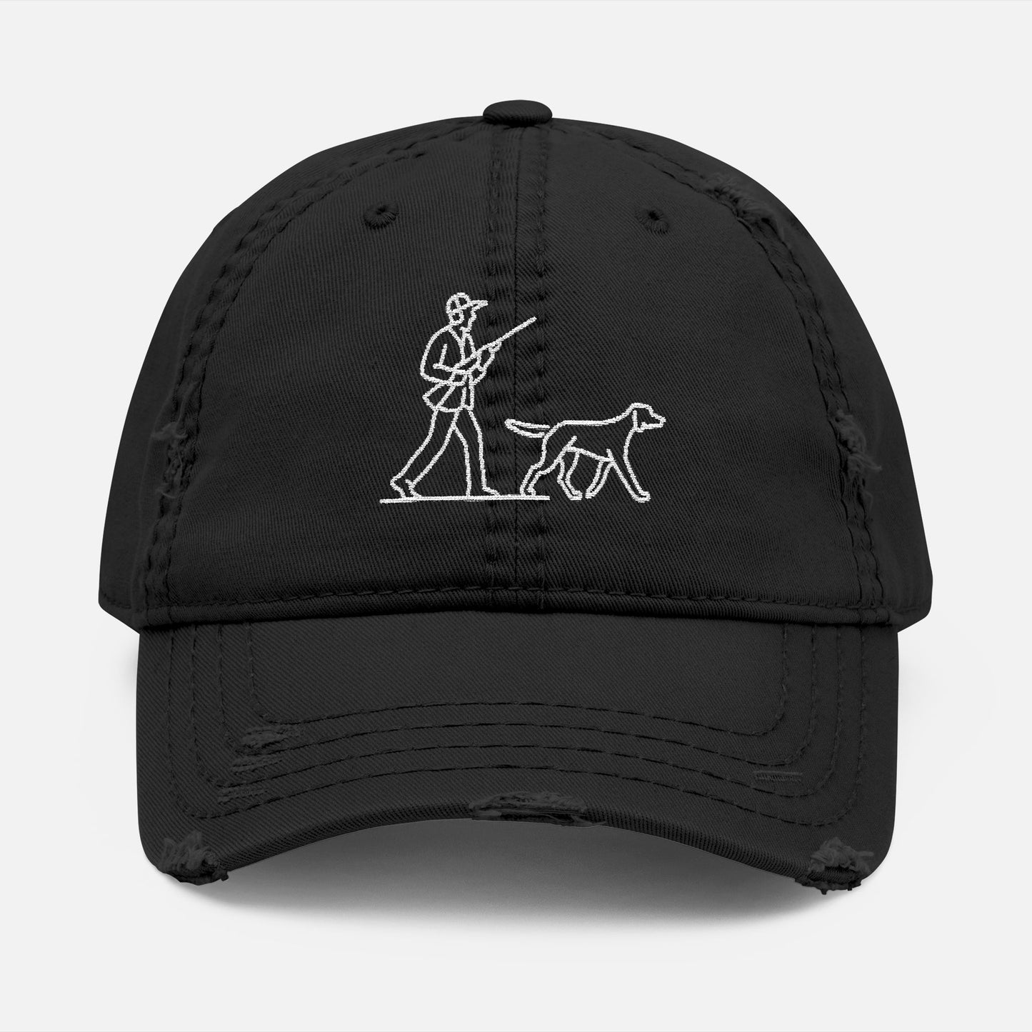 Front view of black low-profile dad hat with line art embroidery of a hunter and dog in classic outdoor scene.