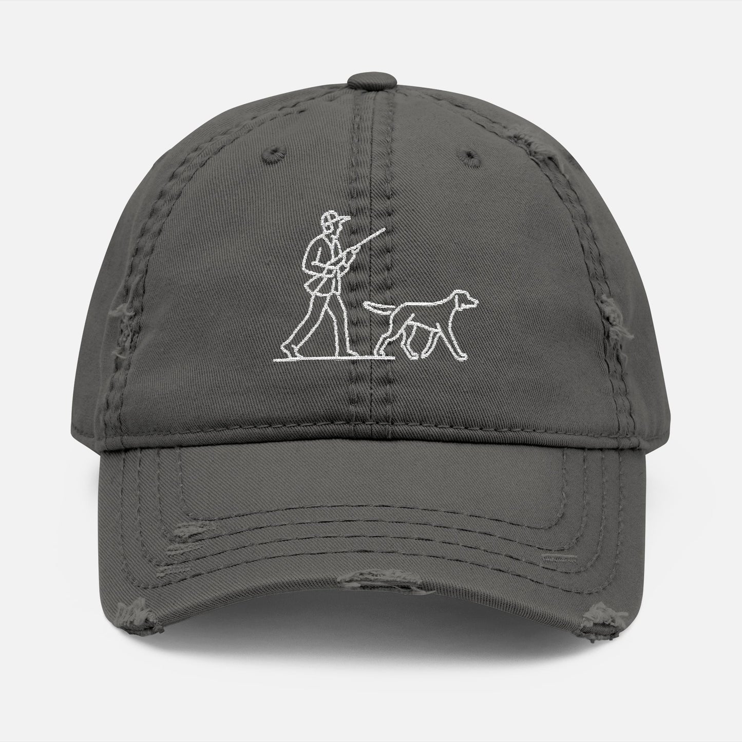Front view of grey low-profile dad hat with line art embroidery of a hunter and dog in classic outdoor scene.