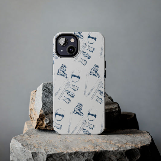 Lifestyle view of a phone with a ski lovers pattern case, placed on a rock showcasing the unique design of ski boots, helmet, skis, gloves, goggles, and ski poles spelling 'LOVE'.