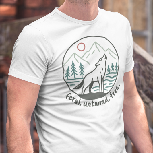 Model wearing Wild Wolf Howling Tee in white, featuring a circular line art design of a wolf howling at the moon with mountains and trees, printed on a softstyle cotton men's t-shirt.