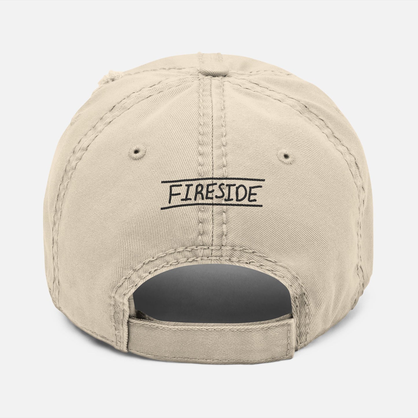 Back view of weathered dad hat with adjustable strap and “Fireside” embroidered in casual handwritten script.