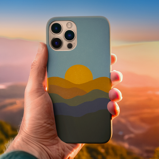 Modern Mountain Sunset Phone Case in use, highlighting tranquil mountain design with warm burnt orange and golden sunset tones.