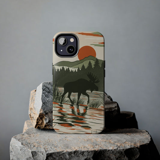 Lifestyle view of  Moose in Marshland Phone Case against a gray background on a rock, featuring a detailed moose illustration in grassy wetland scenery.