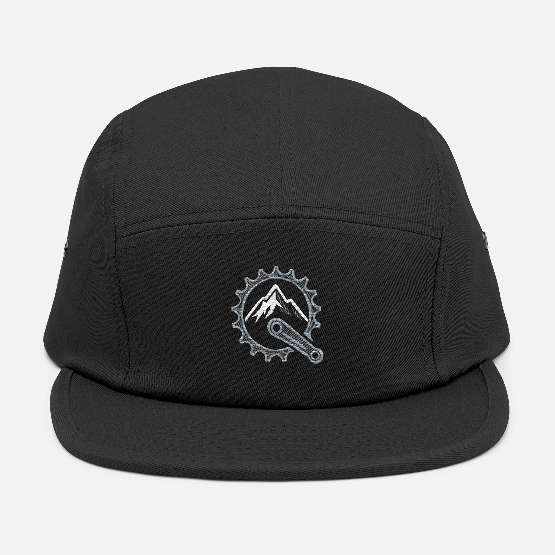 Front view of black 5-panel cap featuring embroidered mountain and bike crank design in metallic silver and white.