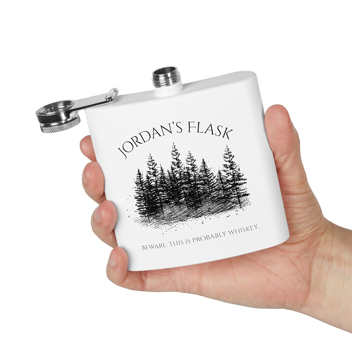 Hand holding personalized forest flask with “Jordan’s Flask – Beware: This is probably whiskey” text, shown on white background.