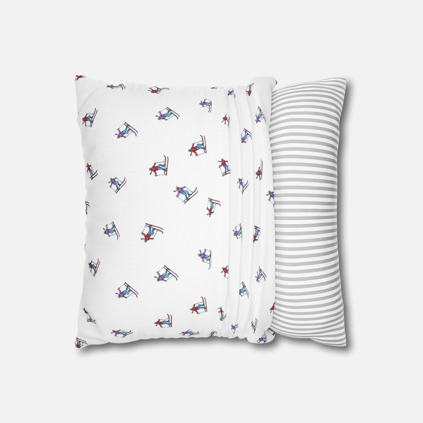 Pillow case with an illustrated skier pattern, partially fitted over a pillow on a white background, demonstrating how it goes over the pillow with the 'Carving the Slopes' design.