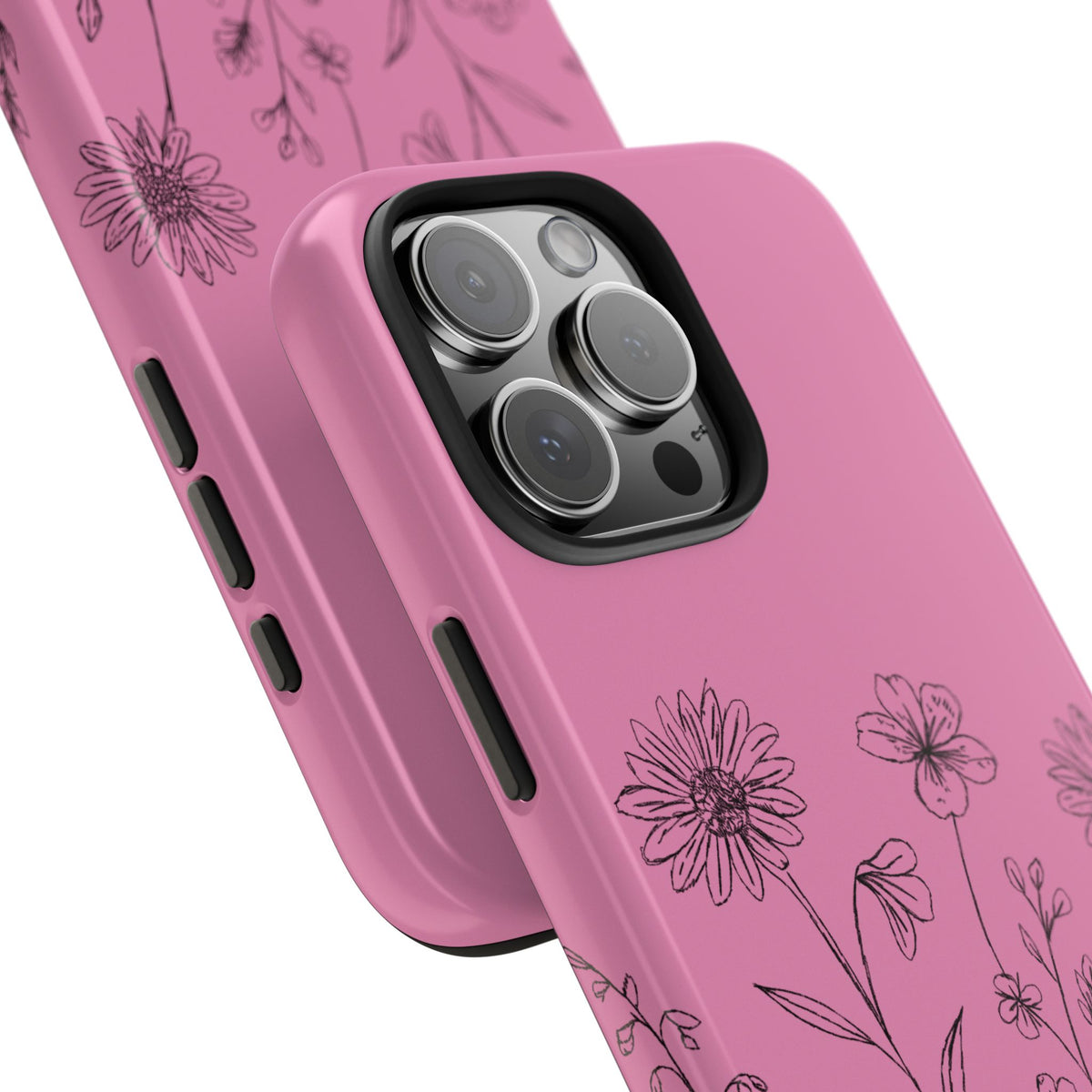 A pink iPhone case with illustrated line art of wildflowers featured on a white background up close on an angle showcasing the camera cut out and glossy shine.