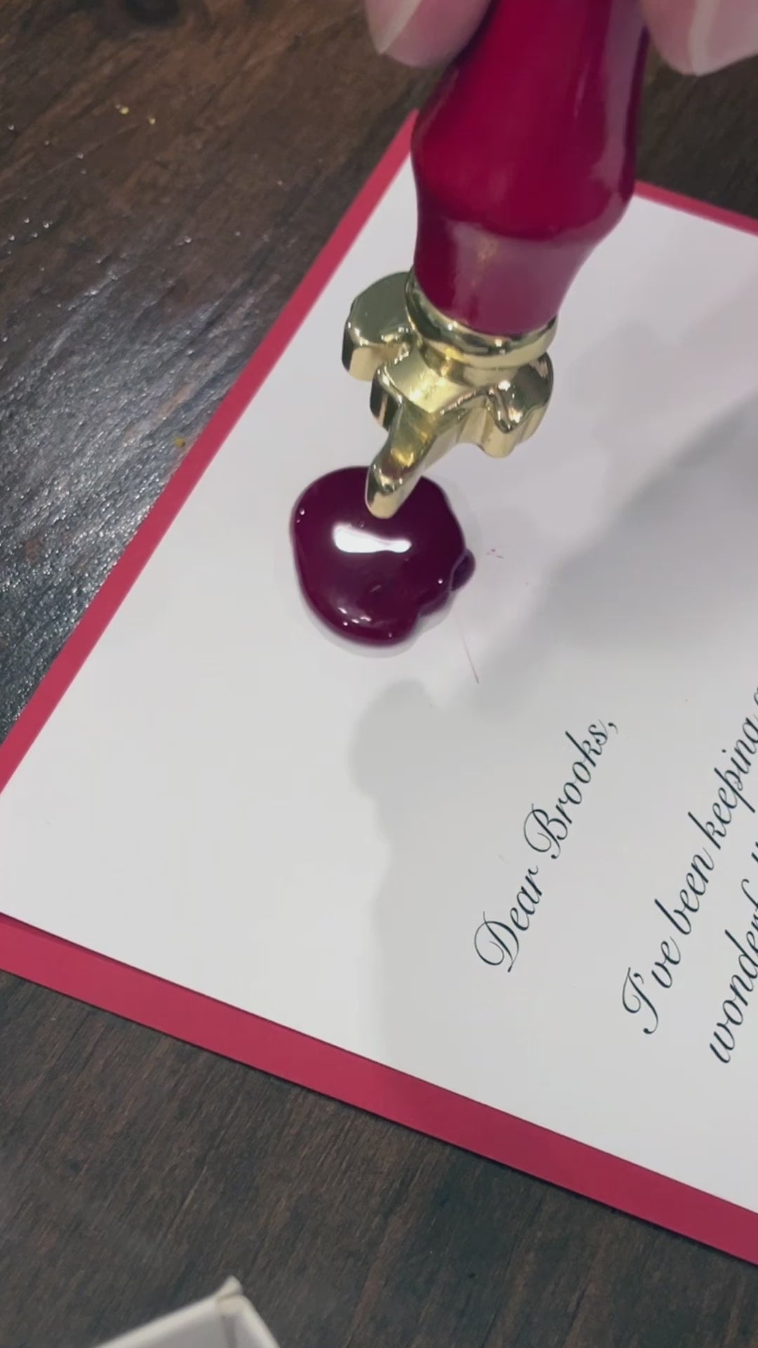 Video showcasing a personalized letter from Santa with a wax seal and envelope, highlighting the intricate details and custom design