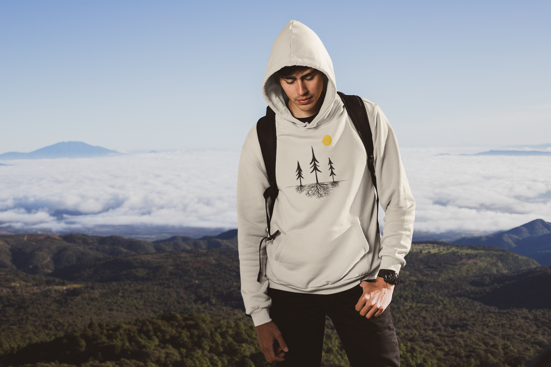 Video showing Sand Colored nature-inspired hoodie featuring a tree silhouette with exposed roots and a sun design. Unisex pullover sweatshirt displayed on a white background, showcasing minimalist outdoor apparel for forest lovers and hikers.