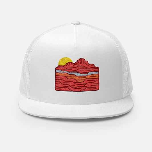 Front design of Bold trucker cap featuring a sun rising over red canyon layers. Rugged, adventurous style for outdoor lovers. Ideal for hiking, camping, and summer wear.