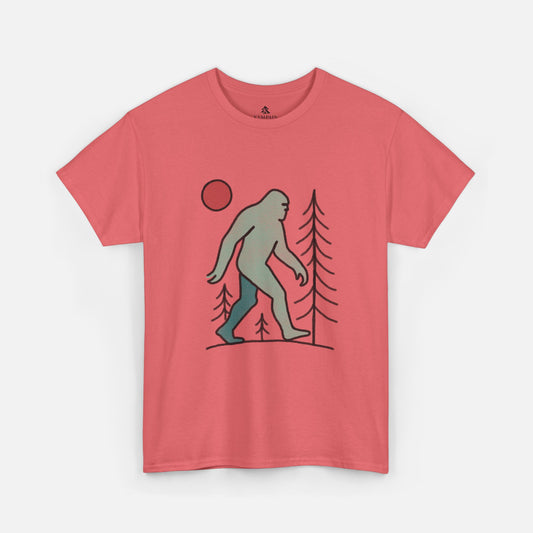 Flat lay of the Sasquatch Red Moon Forest Tee in coral silk color on a white background, featuring a minimalist line art design of Bigfoot walking through pine trees under a red moon