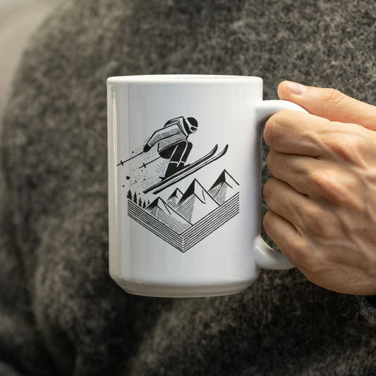 Person holding Ski Jump Mug, featuring a hand-drawn skier mid-air with stylized snow spray, perfect for ski enthusiasts and winter sports lovers.