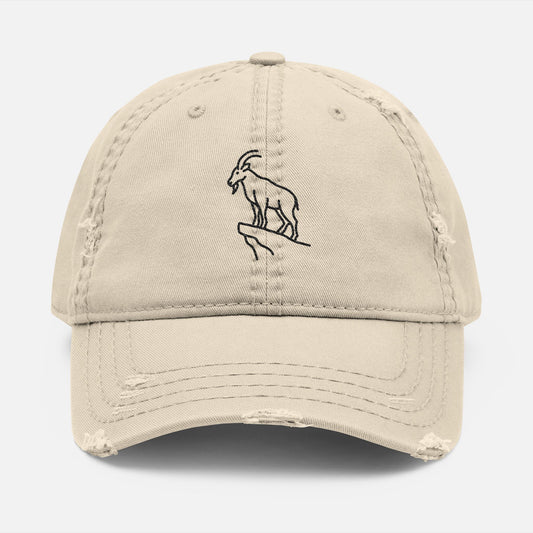 Front view of navy dad hat with embroidered mountain goat design, symbolizing alpine strength and outdoor spirit.